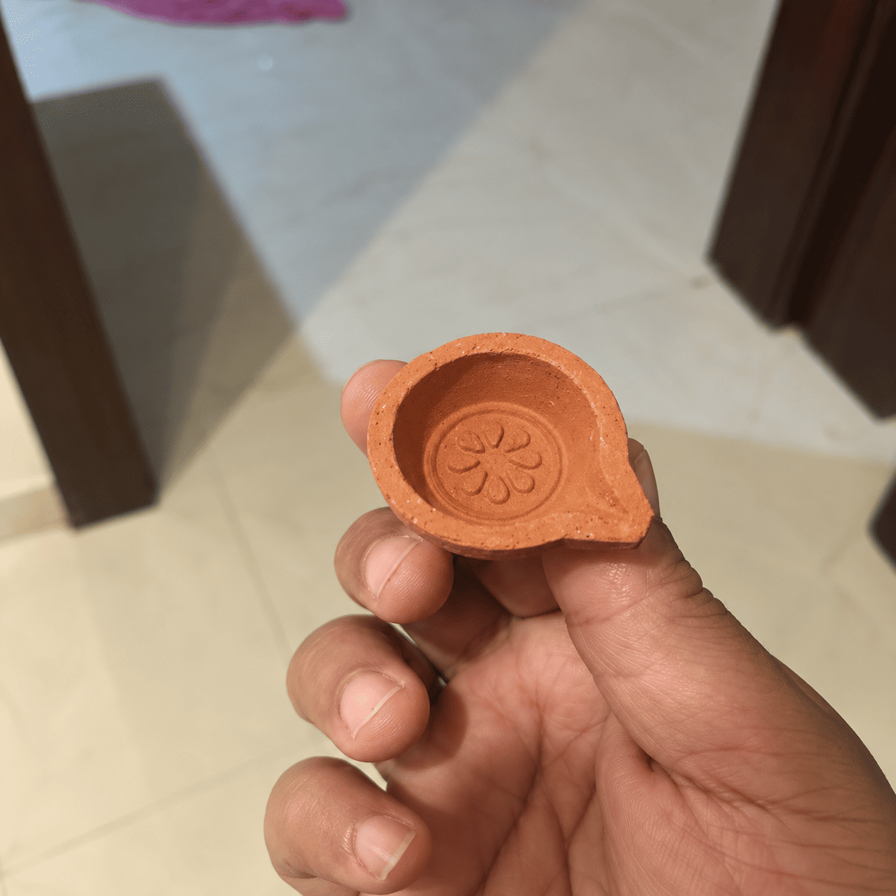handcrafted terracotta diya in hand (1) handcrafted terracotta diya in hand (1)